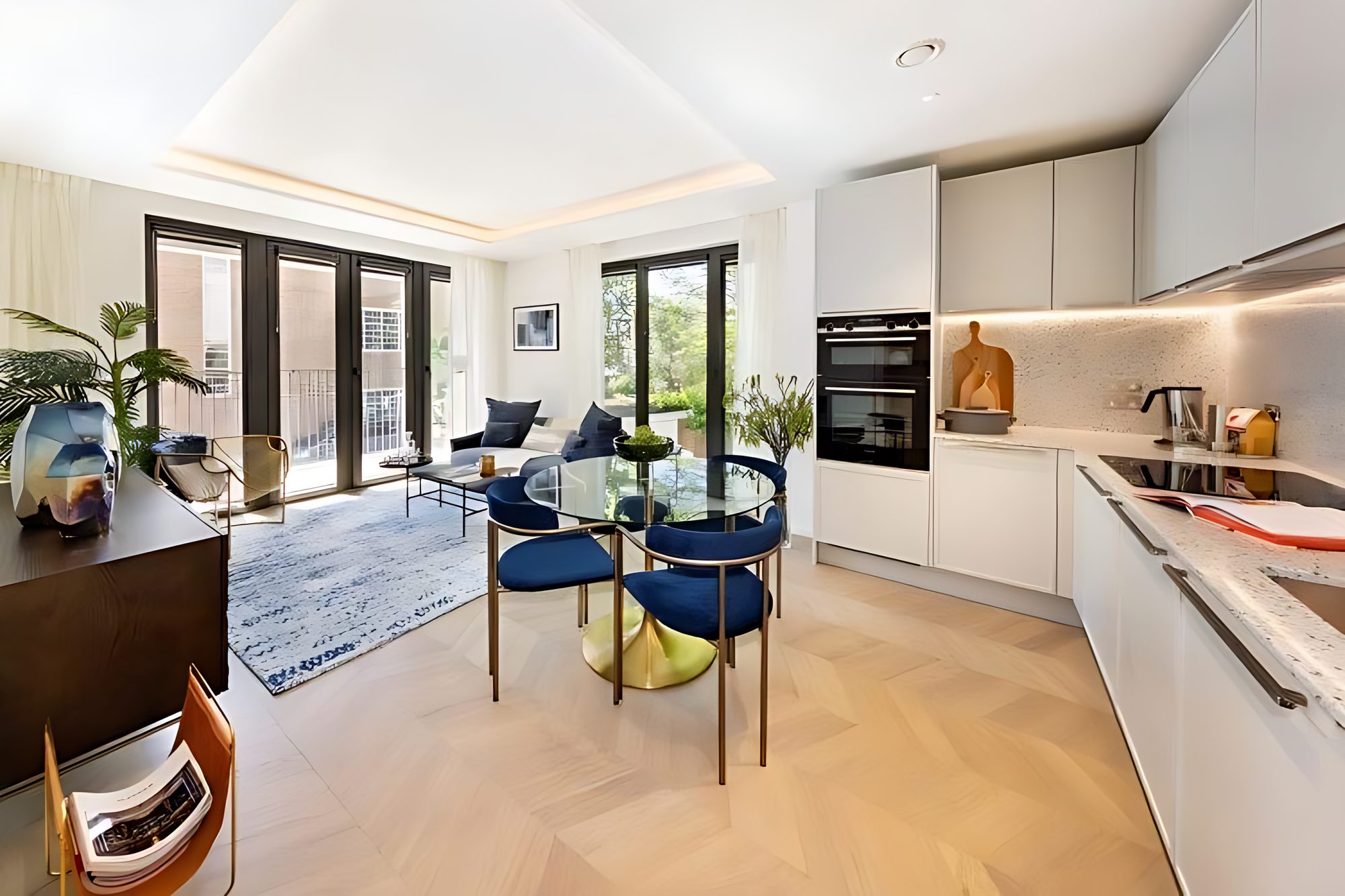 Open-plan kitchen and living space with parquet floor